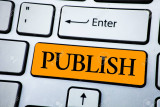 Handwriting text Publish. Concept meaning Make information available to people Issue a written product written Orange Key Button White Keyboard with copy space. Top view.